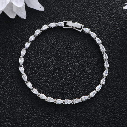 Silver tone pear-cut stone tennis bracelet in titanium steel with clear crystal finish