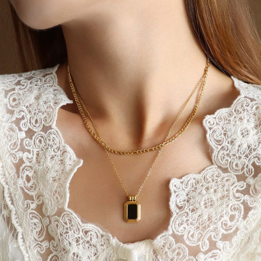 "Reflect your style with a black mirror pendant in 18k."