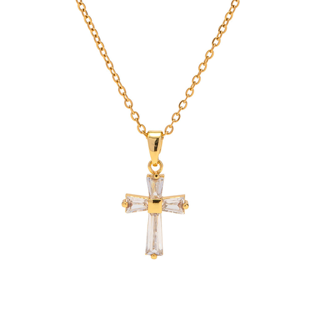 A fine chain connects to the top of the cross, slightly tangled.