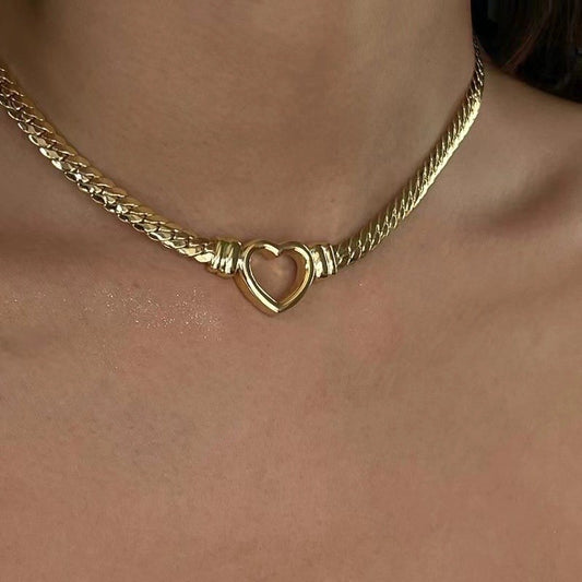 "Titanium steel meets timeless love in the Cuban Link Heart Necklace."