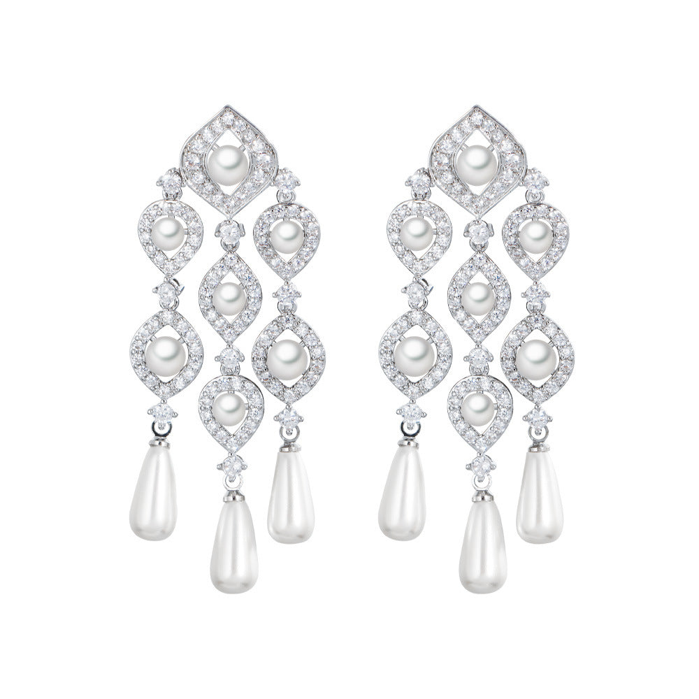 The Pearl Chandelier Earrings are crafted with high-quality, anti-tarnish materials to ensure lasting shine and elegance.