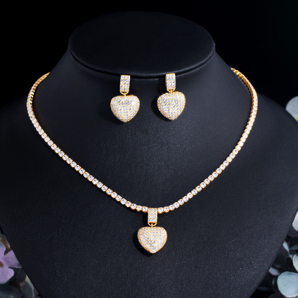 The heart shape symbolizes love, while the diamonds add a glamorous, timeless touch to the design."