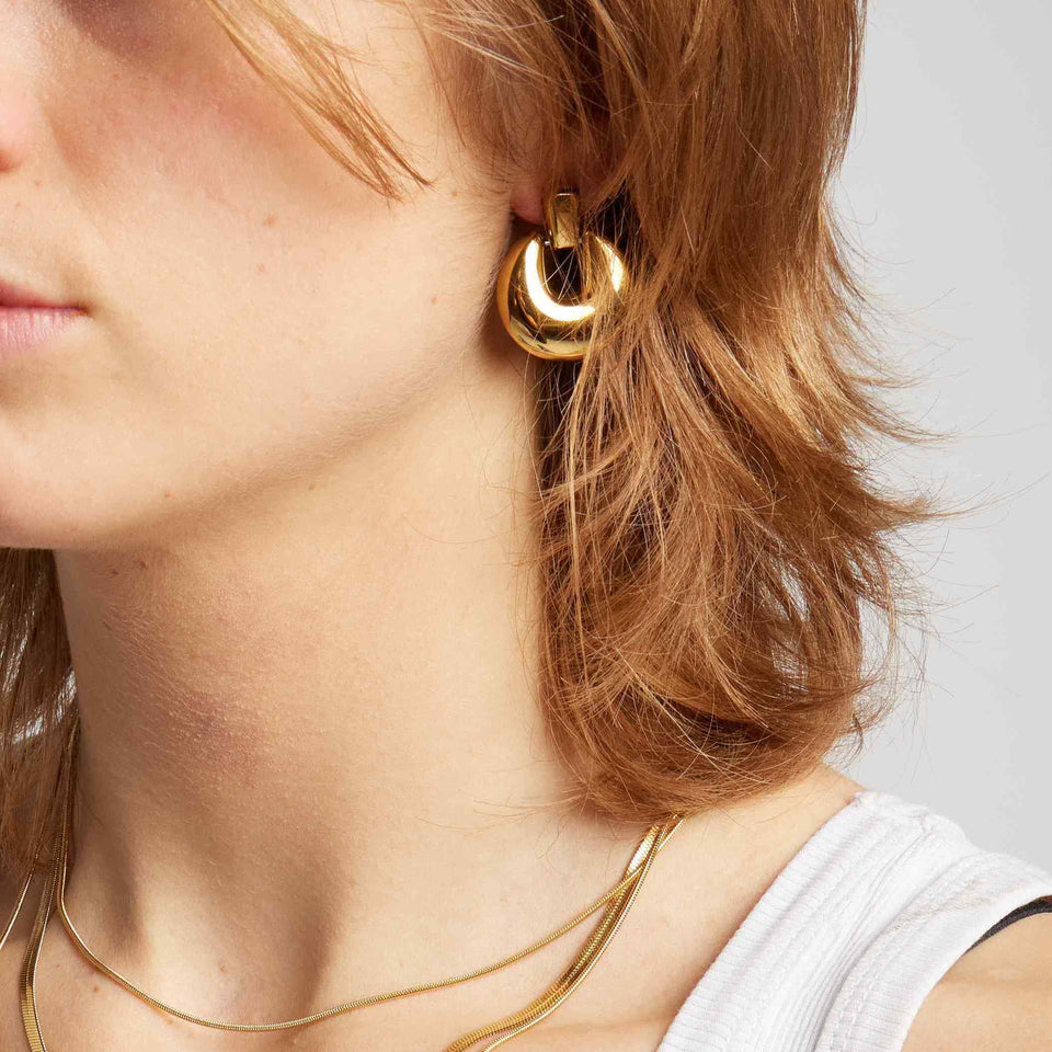18k gold plated over stainless steel Water/Tarnish Resistant
