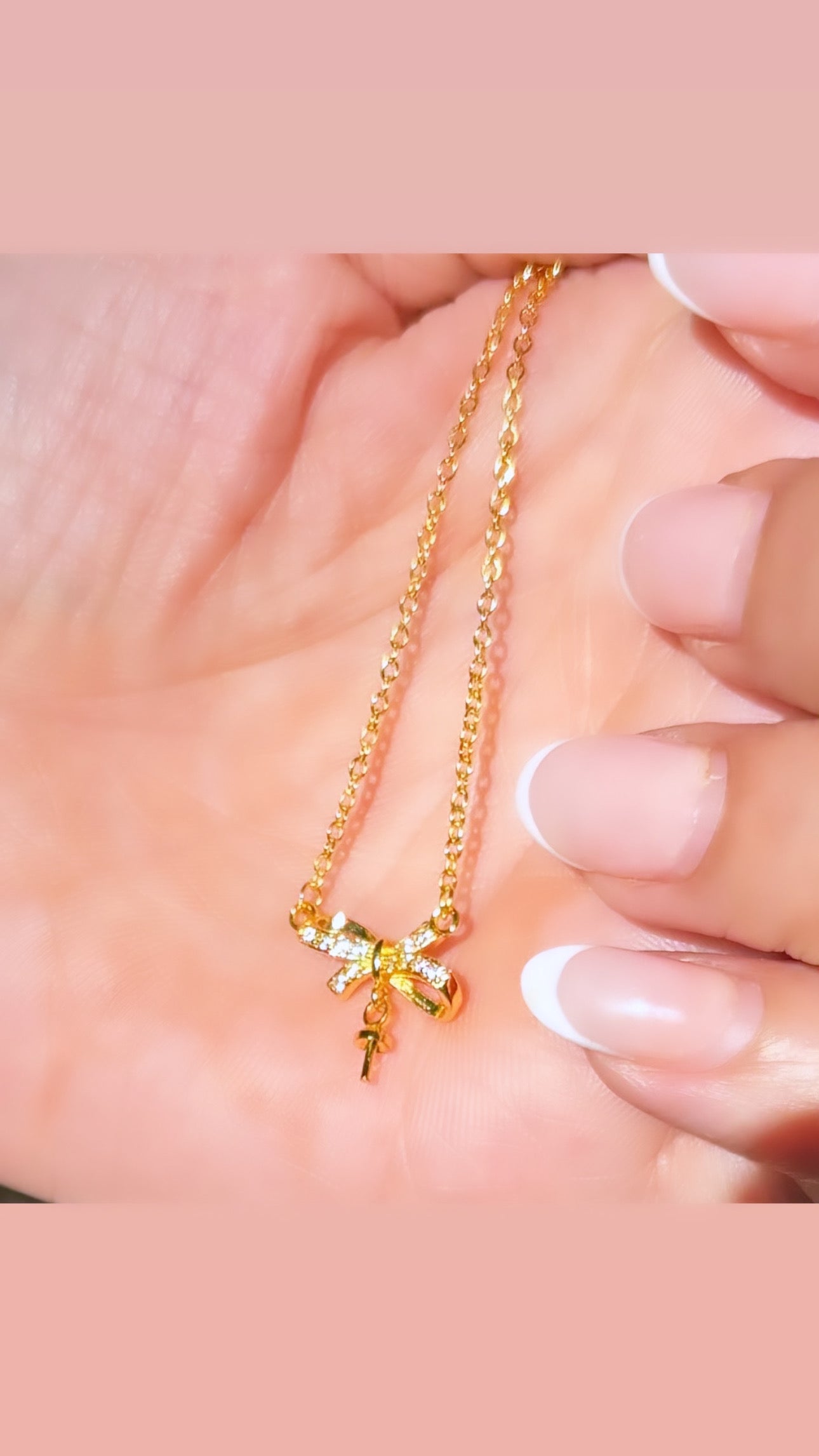 A delicate ribbon necklace with a soft satin finish.
