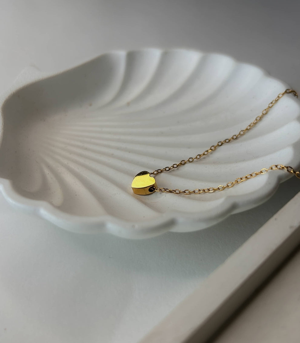 "A golden heart, built to shine with titanium strength."
"Where love and durability meet – the Golden Heart Necklace."