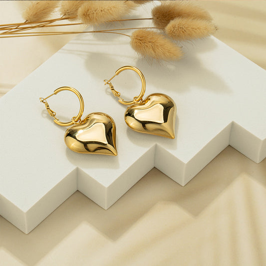 Bold and stylish chunky heart hoop earrings featuring large, thick hoops shaped into heart forms