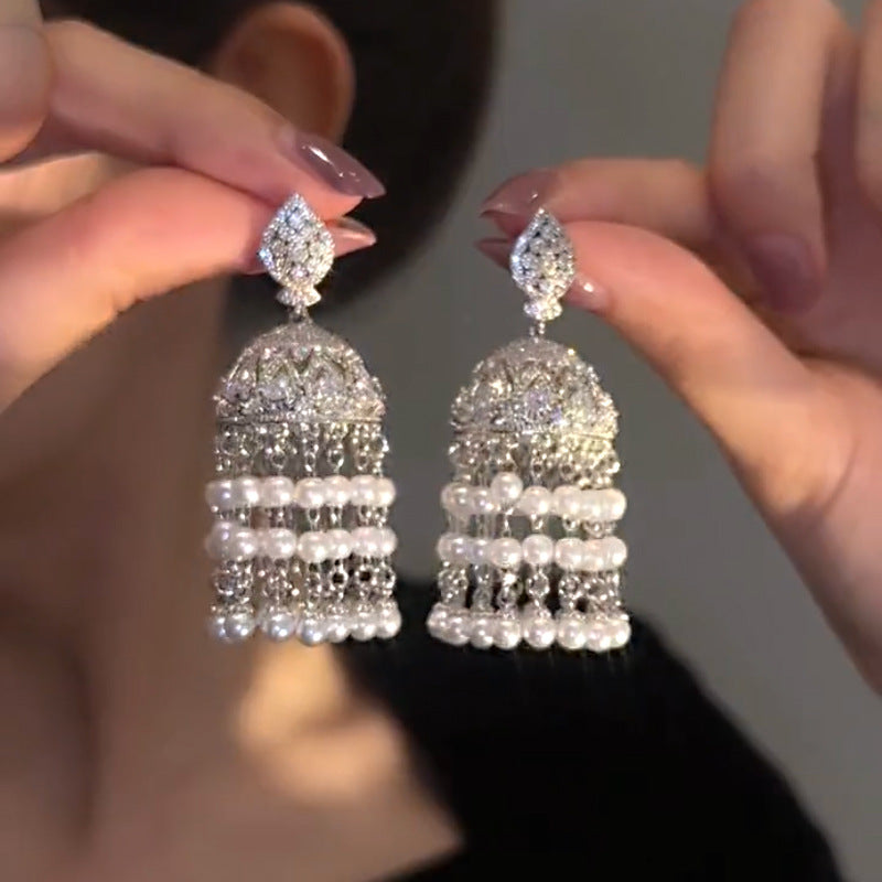 Stunning bold Jhumka earrings with intricate detailing and a traditional design.