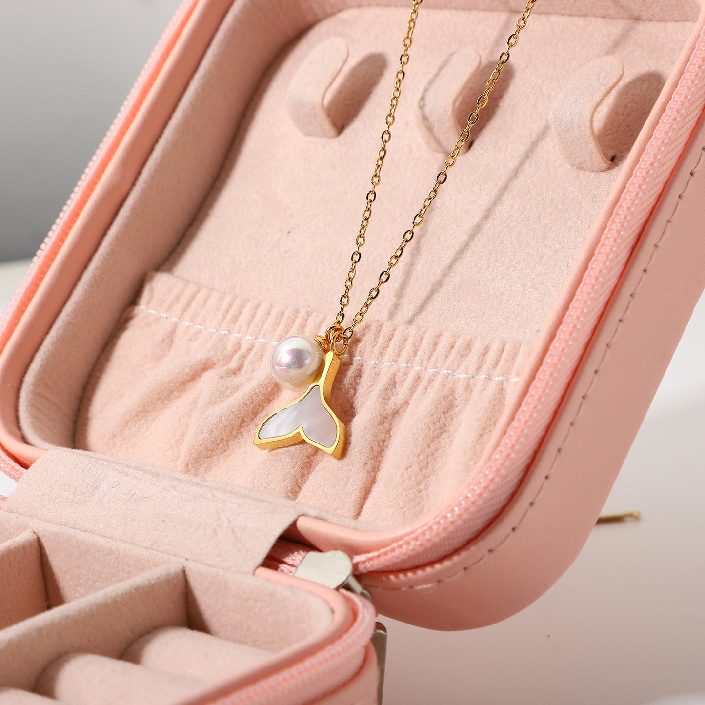 this necklace showcases the beauty of pearls in a unique and contemporary design.