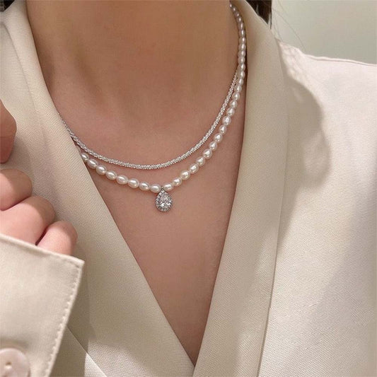 "Elegance redefined with pearls and a silver touch."
"Timeless pearls, beautifully paired with a silver chain."
