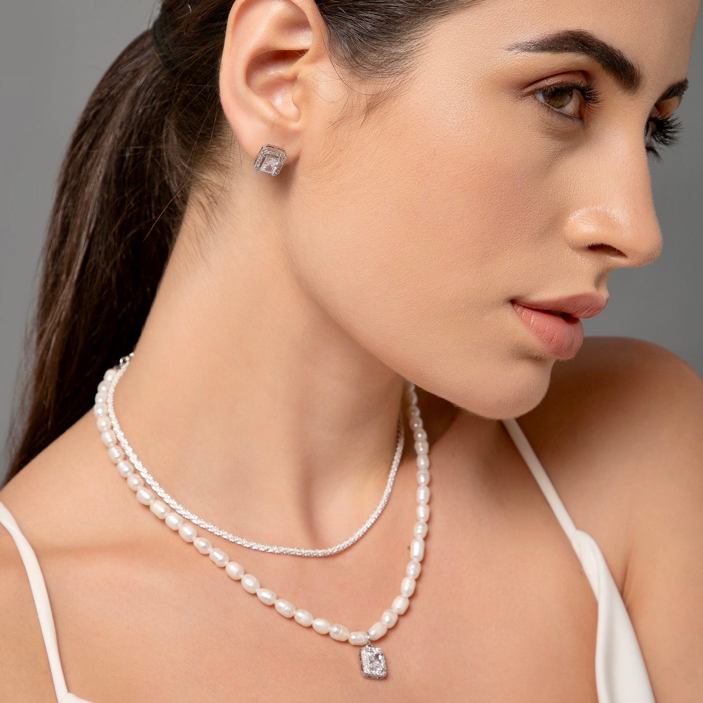 showcasing a lustrous necklace.