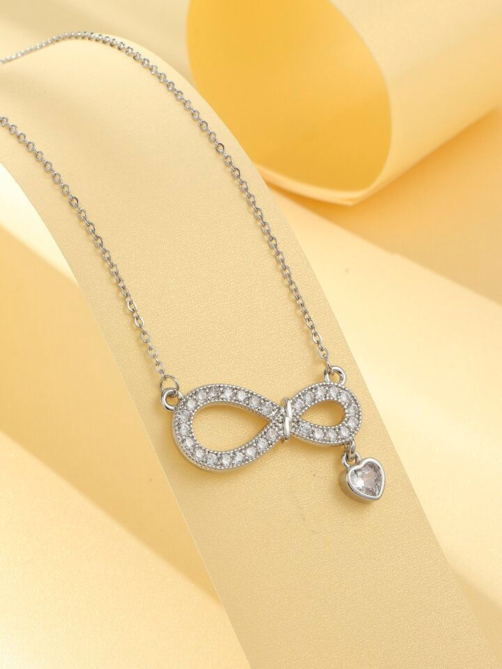 The infinity shape symbolizes eternal love, balance, and connection.