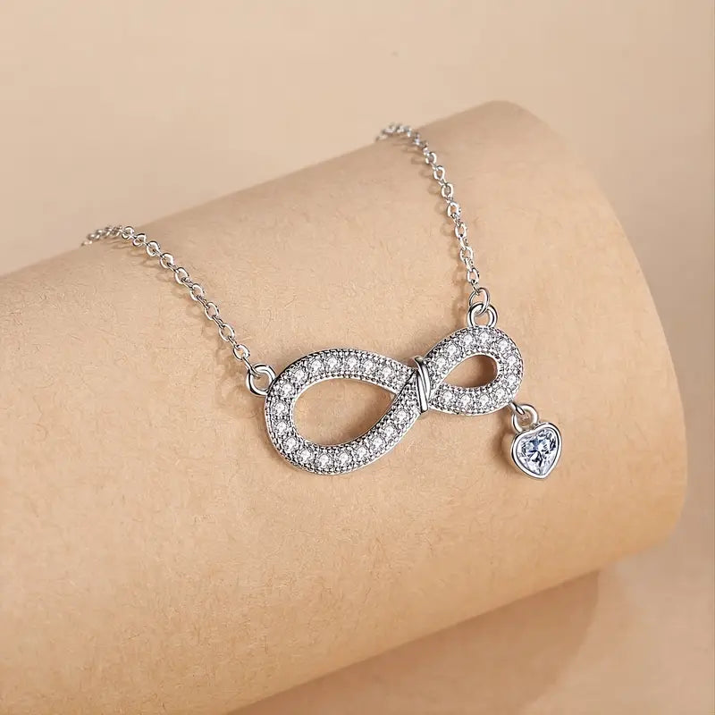 the pendant is encrusted with tiny, shimmering stones for added sparkle.
