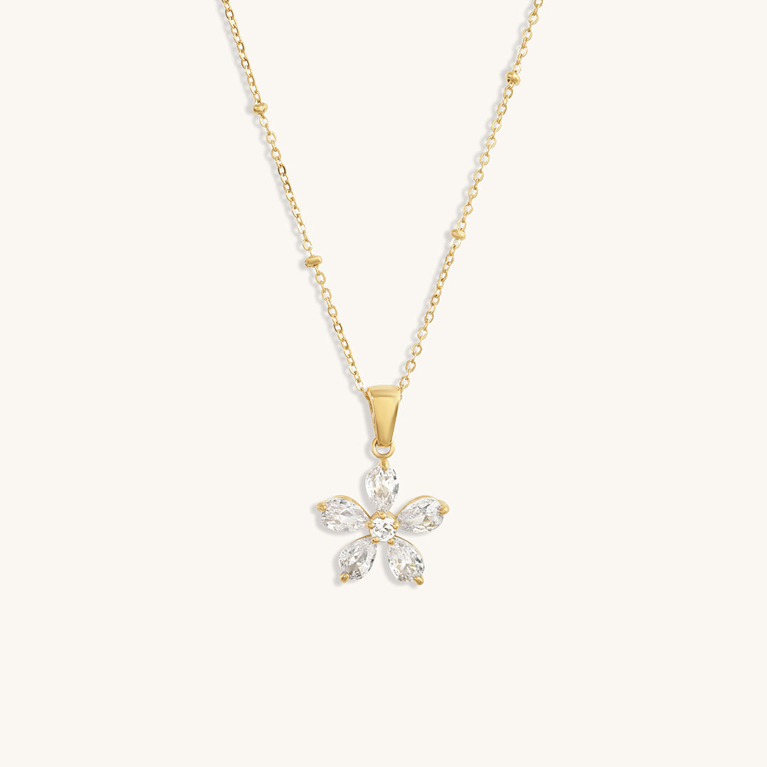 "A floral touch, forever in bloom."
"Wear a blossom of elegance around your neck."