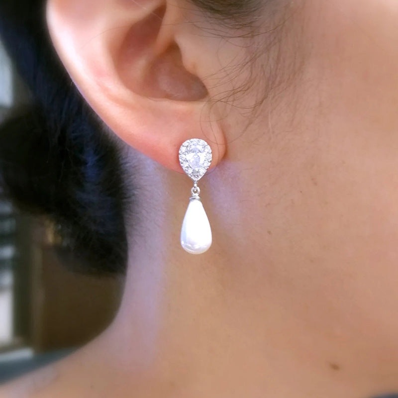 Perfect for adding a touch of sophistication, the Pearl Dewdrop Earrings offer subtle glamour for both day and night wear.