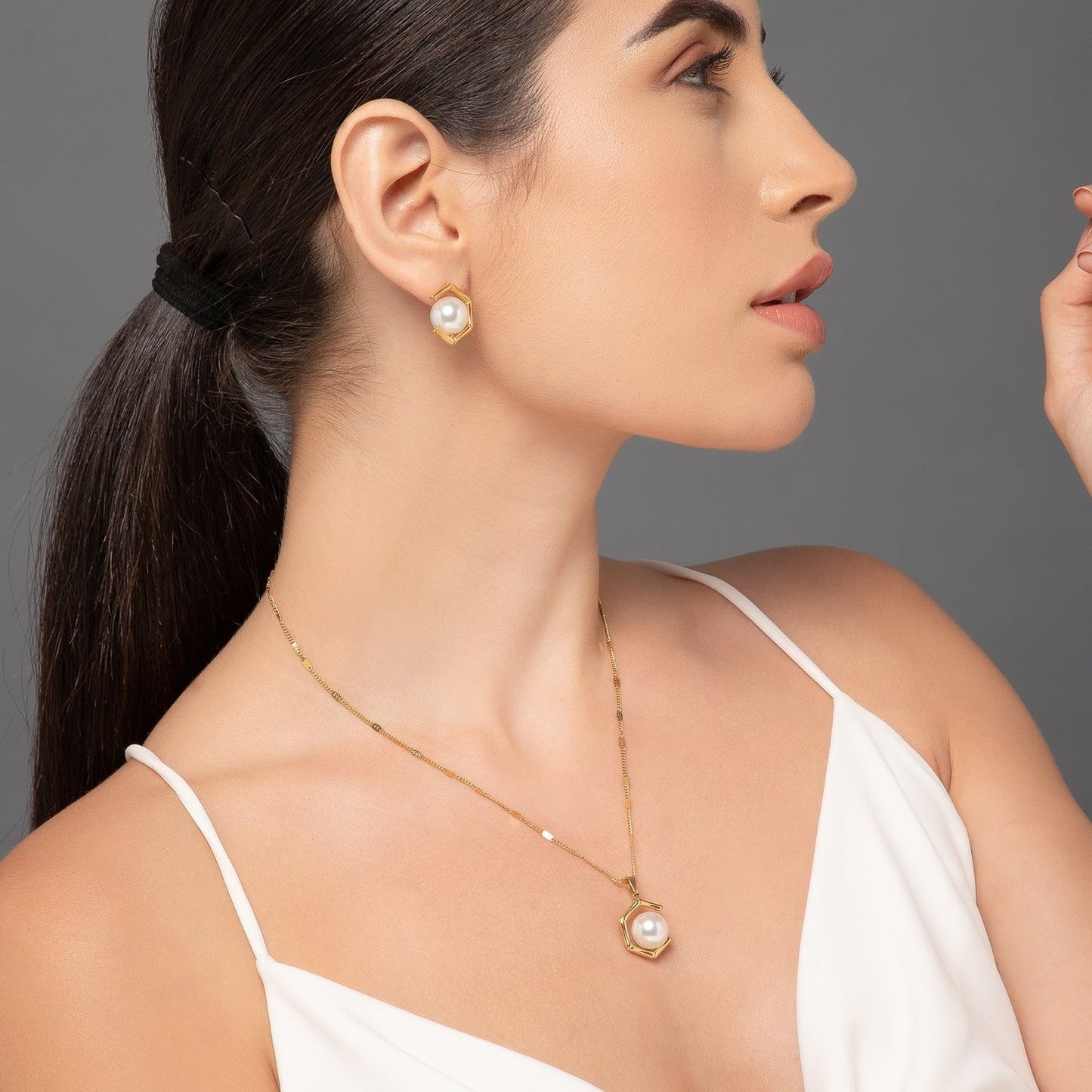 "Where geometry meets grace in a stunning pearl design."
"Sculpted beauty, enhanced by the elegance of pearls."