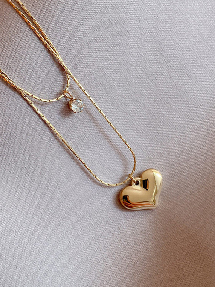 "The perfect layers of love and style – the Desirable Heart Necklace."