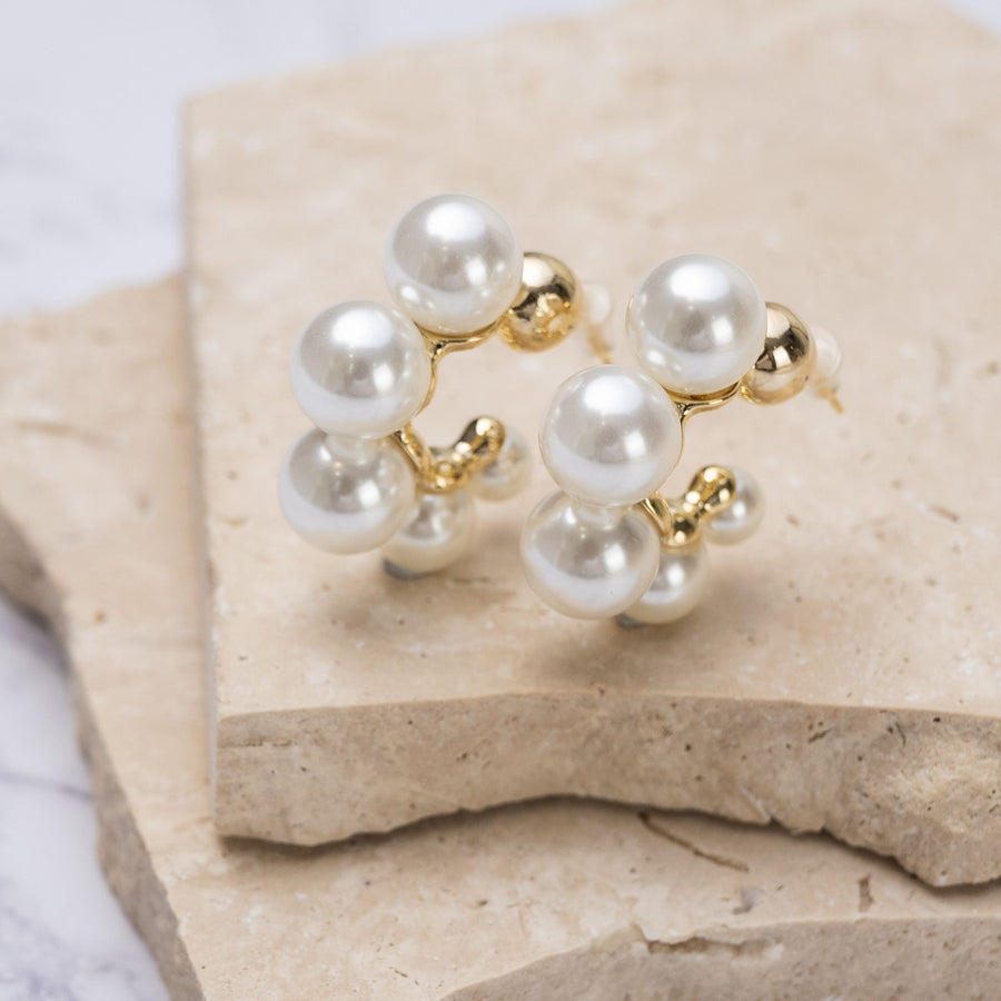 "Timeless Pearl Hoops Earrings featuring lustrous pearls on sleek hoops,
perfect gift for any occasion with their elegant and versatile design."