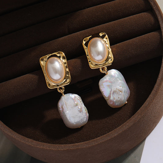 The Princess Drop Baroque Pearl Earrings feature a luxurious design with unique Baroque pearls, offering a modern twist on classic elegance.