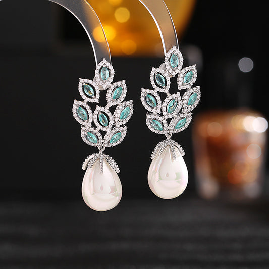 "With their delicate drop design and vibrant blue hues, these earrings bring a fresh and elegant touch to any outfit."