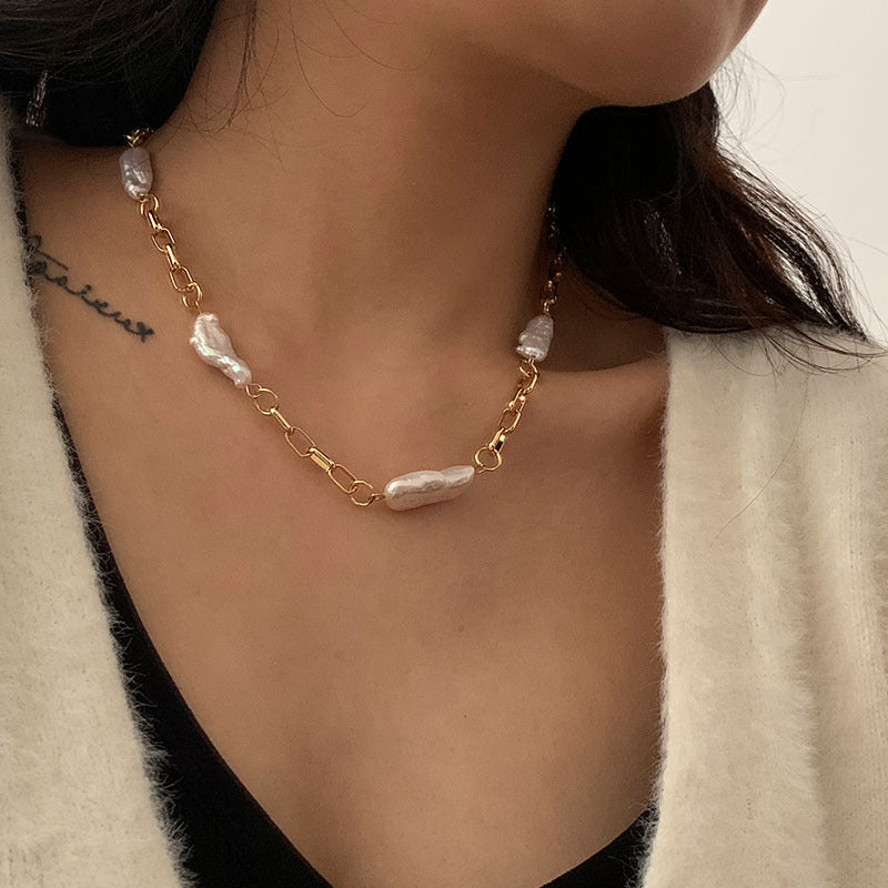 "The Chunky Baroque Link Necklace combines bold, oversized links with the unique beauty of Baroque pearls for a statement-making look."