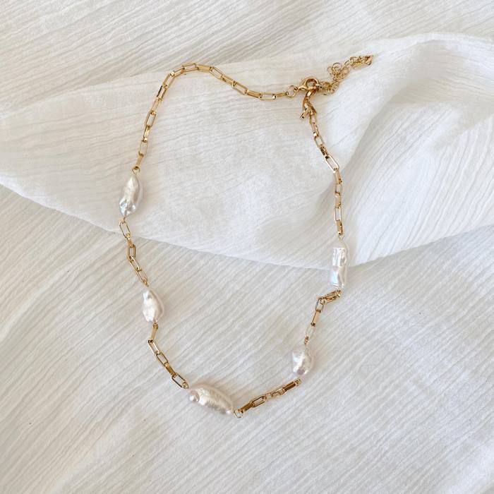 "A luxurious and versatile piece, the Chunky Baroque Link Necklace can be worn to dress up casual looks or add sophistication to evening attire."