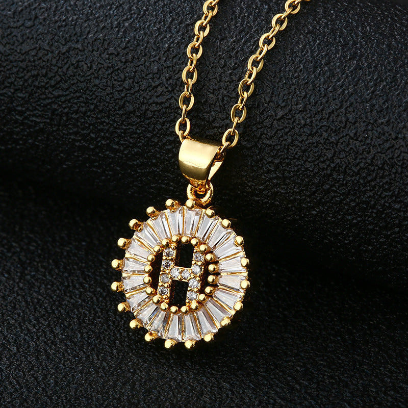 The pendant is shaped like an elegant alphabet letter.