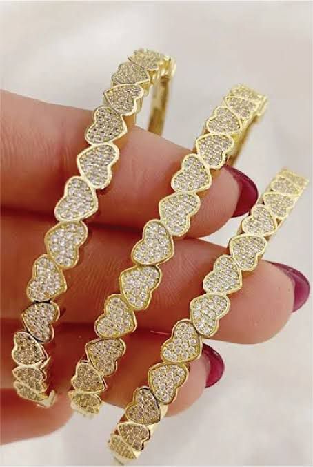 Elegant Heartfelt cuff bracelet featuring a sleek, open design with a heart-shaped accent at the center.