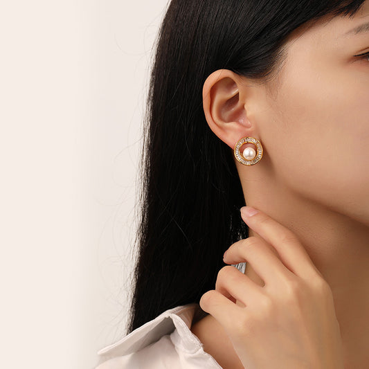 Modern Pearl Irregular Circle Earrings featuring a lustrous pearl set in an artistic, irregular circle design, offering a chic and contemporary look."