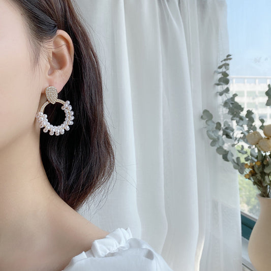 Elegant Pearl Earrings featuring a smooth
"Anti-tarnish pearl earrings with a polished finish."