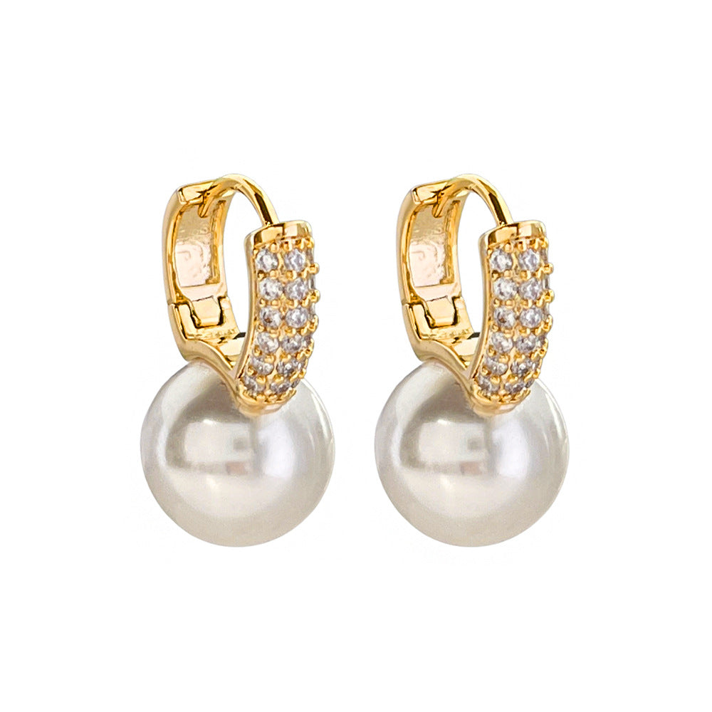 Classic elegant pearl and diamond earrings: Large 12mm shiny pearls hang under a sparkling diamond clasp to create classic pearl diamond earrings.