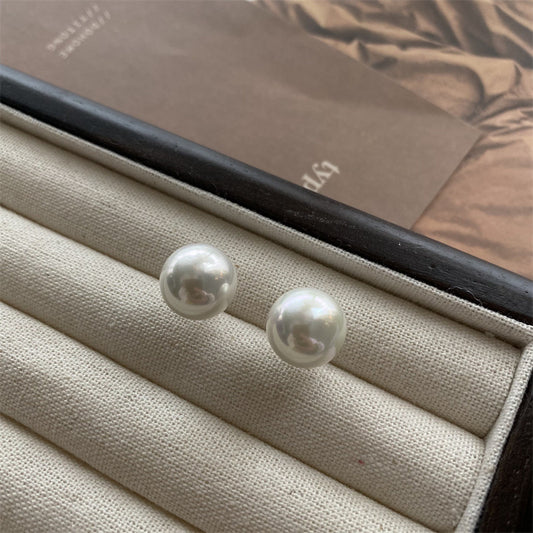 Stylish Pearlicious Earrings featuring lustrous pearls, designed to add elegance and sophistication to any look with their timeless charm."