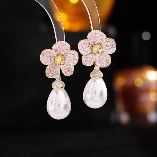 "These earrings are a beautiful mix of subtle floral elegance and dazzling stones, making them perfect for both casual and formal occasions."