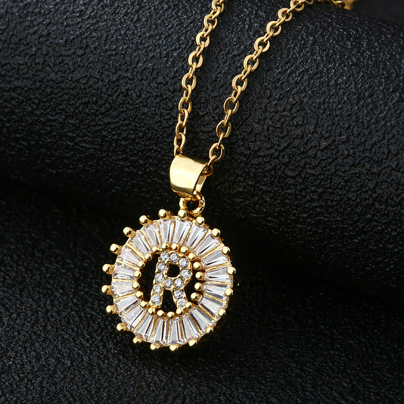 A sleek pendant necklace featuring a single alphabet letter at its center.