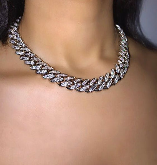 An 8MM Cuban link necklace fully studded with sparkling accent stones.