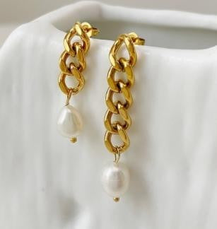 Elevate your outfit with the understated elegance of the Tucker Pearl Earrings, crafted to enhance any look.