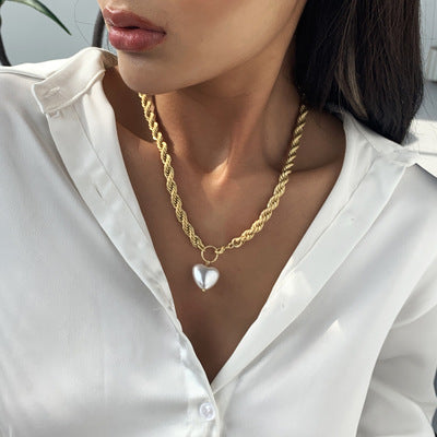 "Soft and serene, the white heart pendant necklace."
"Pure love, timelessly captured in a white heart."