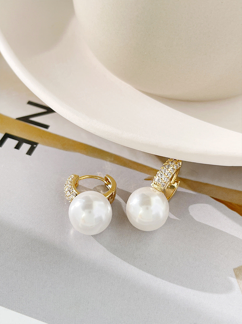 "These earrings feature high-quality faux pearls, providing a luxurious look without the price tag of natural pearls."