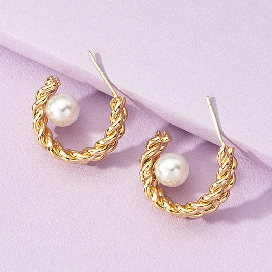"Anti-tarnish pearl earrings with a polished finish."
