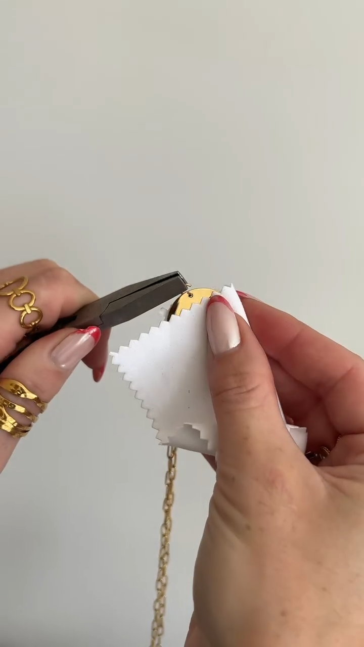 Hand-polishing the charm