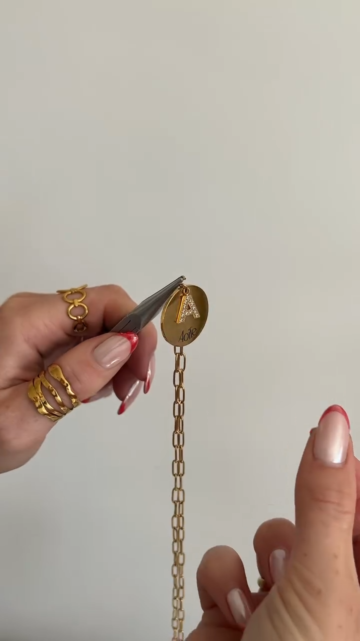 Threading the charm onto its chain