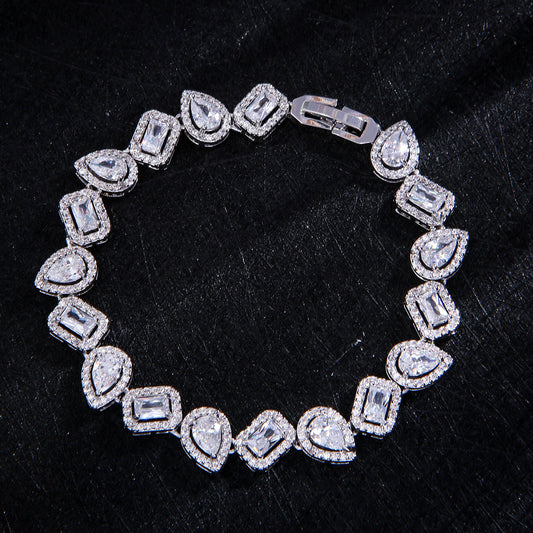 Silver tone mix-cut tennis bracelet with pear and baguette stones in titanium steel with halo crystal setting