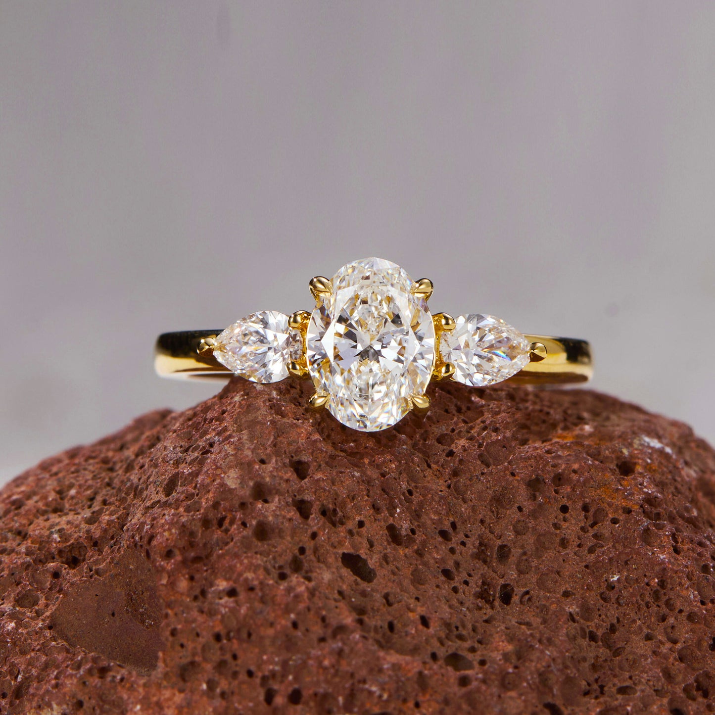 Oval Radiance Three-Stone Gold Ring