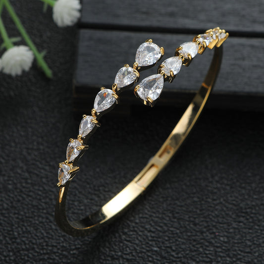 Real gold plated open bangle with pear-cut crystal stones in titanium steel