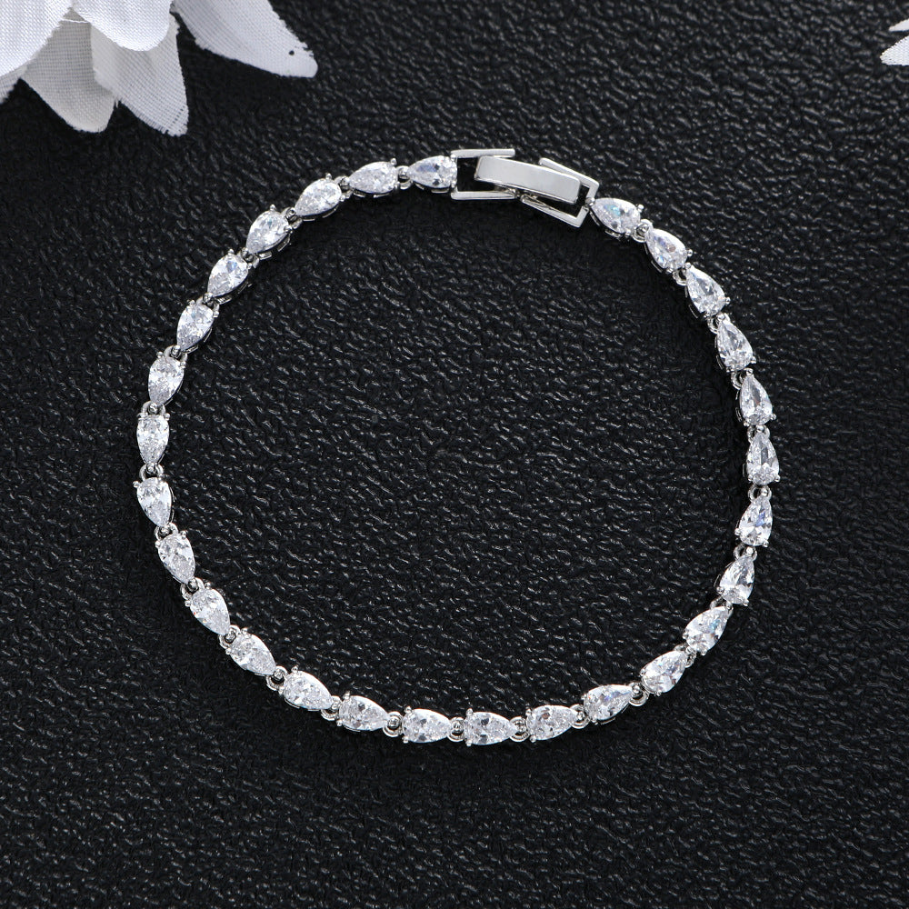 Silver tone pear-cut stone tennis bracelet in titanium steel with clear crystal finish