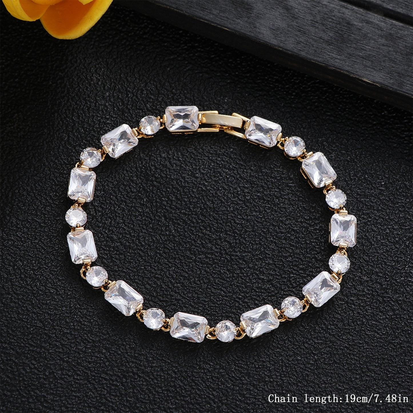 Real gold plated rectangular stone tennis bracelet in titanium steel with clear crystal detailing