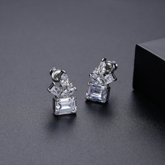 Silver tone stud earrings with baguette and marquise-cut stones in titanium steel