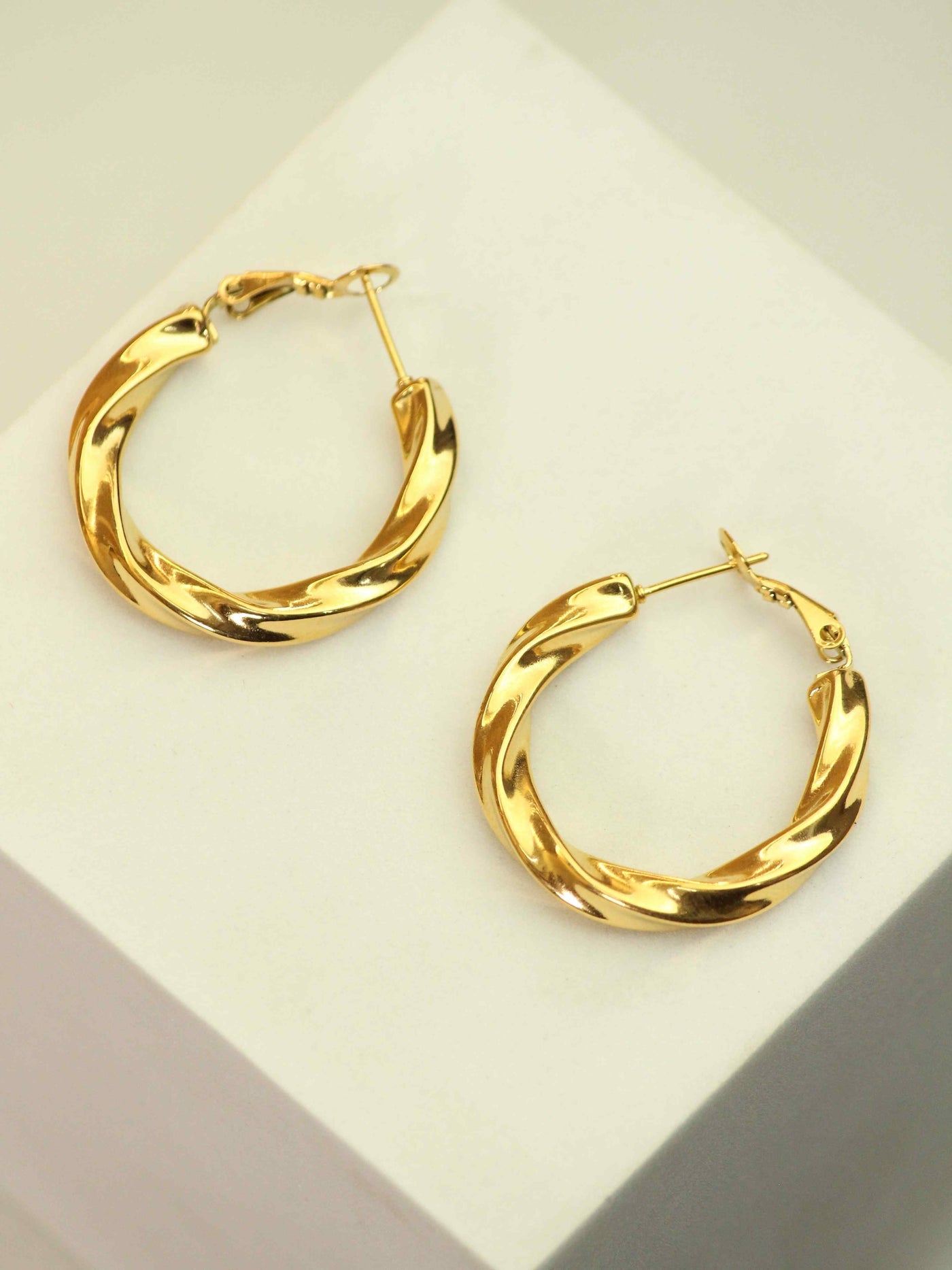 Twist & Twirl Gold Hoop Earrings – www.zewar.co