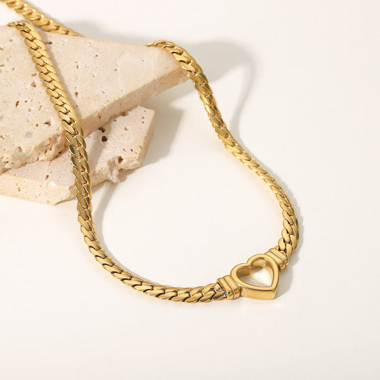 "Durability and elegance, intertwined in the Cuban Link Heart Necklace."
