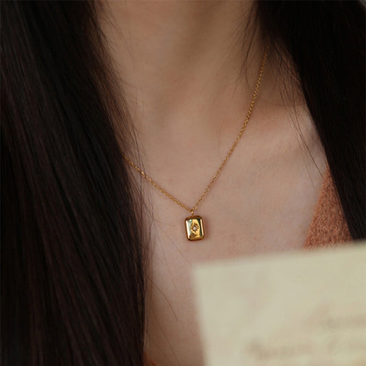 "Gold meets diamond in this stunning bar necklace."