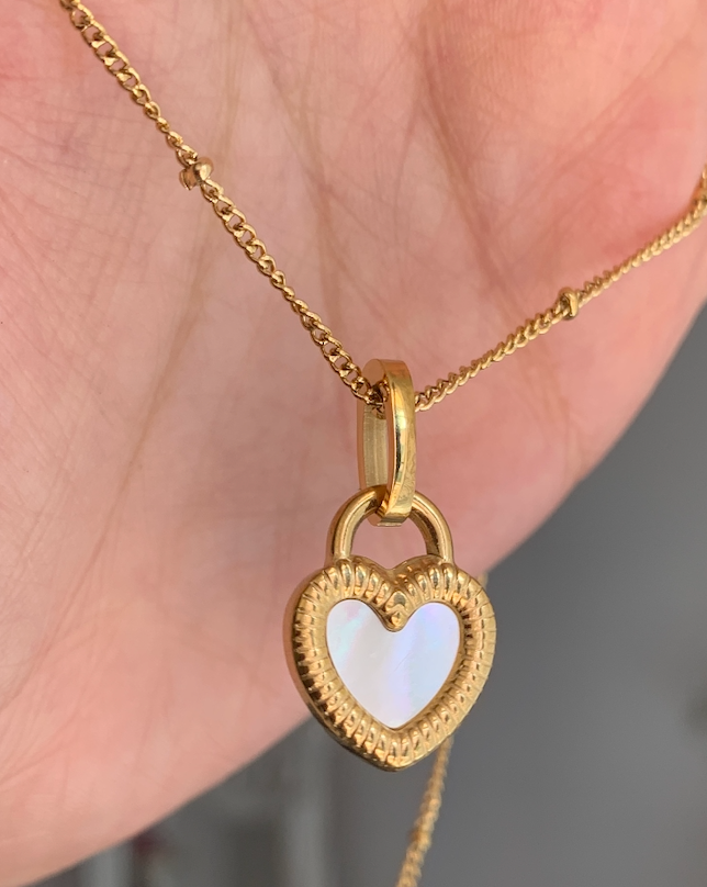"Two looks, one necklace – a heart that shines both ways."

"From one side to the other, love is always in style."